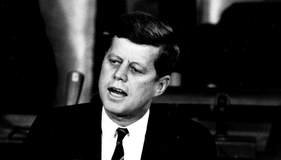 A black-and-white photograph of John F. Kennedy.